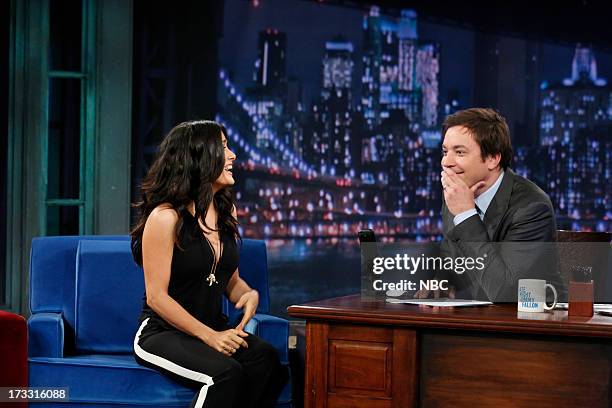 Episode 862 -- Pictured: Actress Salma Hayek Pinault gives some hands on hair styling tips to host Jimmy Fallon during an interview on the July 11,...