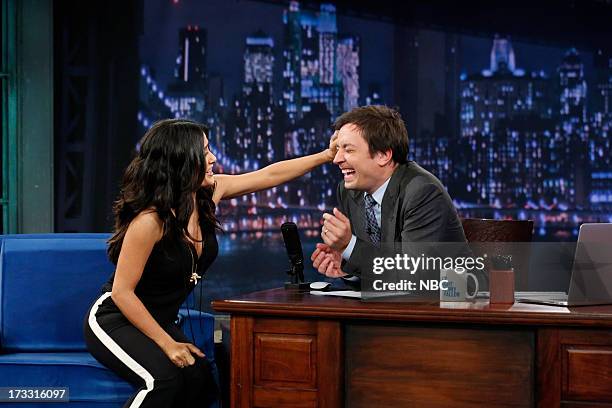 Episode 862 -- Pictured: Actress Salma Hayek Pinault gives some hands on hair styling tips to host Jimmy Fallon during an interview on the July 11,...