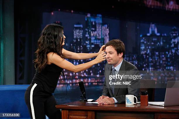 Episode 862 -- Pictured: Actress Salma Hayek Pinault gives some hands on hair styling tips to host Jimmy Fallon during an interview on the July 11,...