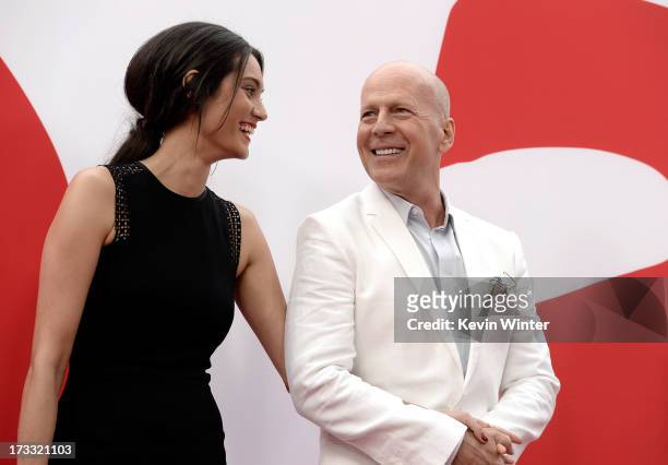 Actor Bruce Willis and Emma Heming attend the premiere of Summit Entertainment's "RED 2" at Westwood Village on July 11, 2013 in Los Angeles,...