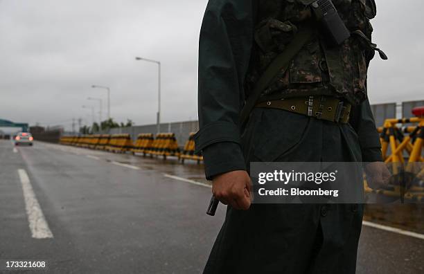 South Korean soldier stands guard at a military check point on the Unification Bridge, linked to North Korea, near the demilitarized zone in Paju,...