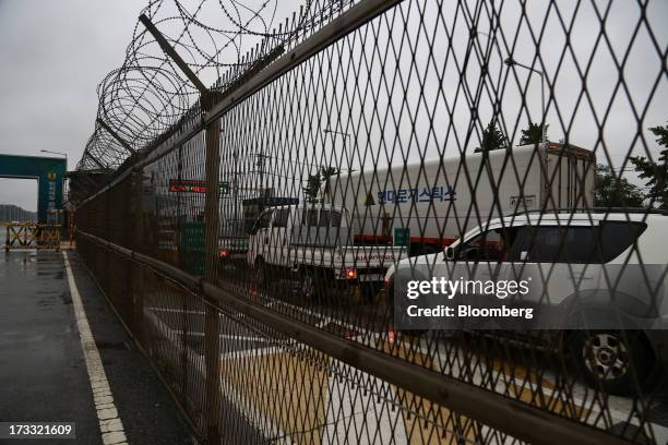 Vehicles traveling toward Gaeseong Industrial Complex wait in line at a military check point on the Unification Bridge, linked to North Korea, near...