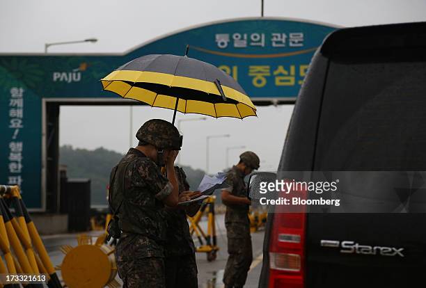 South Korean soldiers inspect vehicles at a military check point on the Unification Bridge, linked to North Korea, near the demilitarized zone in...