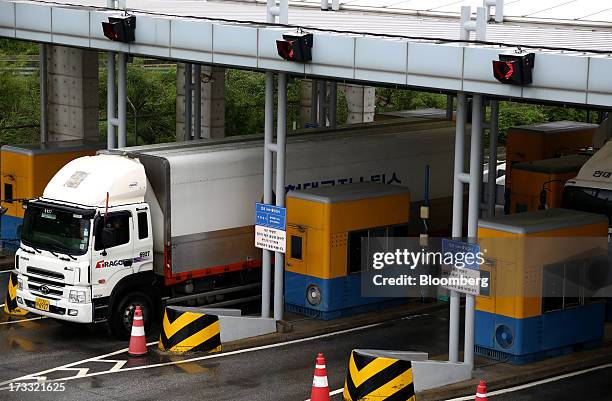 Truck passes through a gate at the Customs, Immigration and Quarantine office as they travel toward the Gaeseong Industrial Complex, on a road linked...