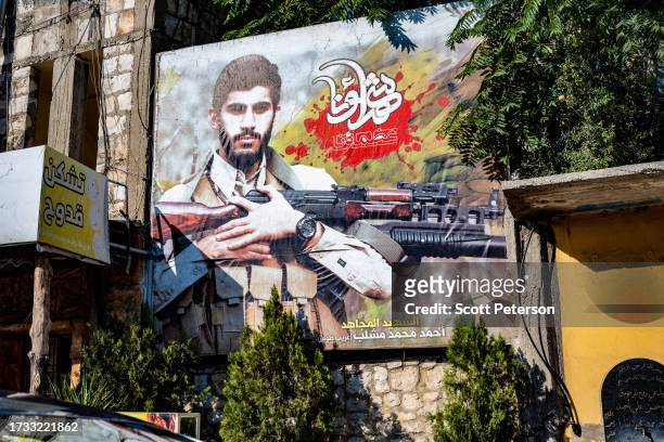 Billboard celebrating the death of a martyred fighter in Syria is put up by Hezbollah, the powerful, Iran-backed Shiite militia of Lebanon, in the...