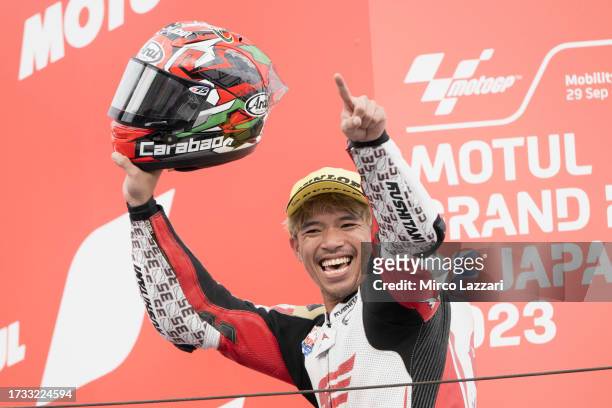 Somkiat Chantra of Thailand and Idemitsu Honda Team Asia celebrates the victory on the podium during the Moto2 race during the MotoGP of Japan - Race...