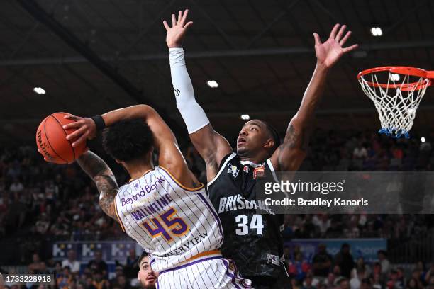 Denzel Valentine of the Kings looks to pass under pressure from from Chris Smith of the Bullets during the round three NBL match between Brisbane...