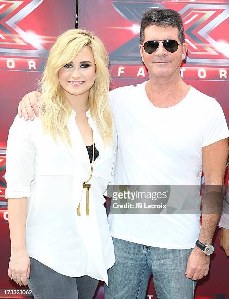 Demi Lovato and Simon Cowell attend Fox's 'The X Factor' Judges at Galen Center on July 11, 2013 in Los Angeles, California.
