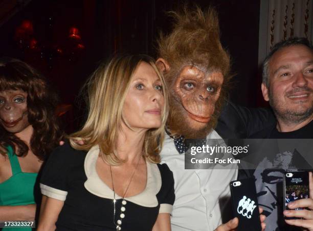 Actress Valerie Steffen and a member of the 'Monkey Crashers' attend 'Apero Chic' Party At Hotel Pershing Hall on July 11, 2013 in Paris, France.