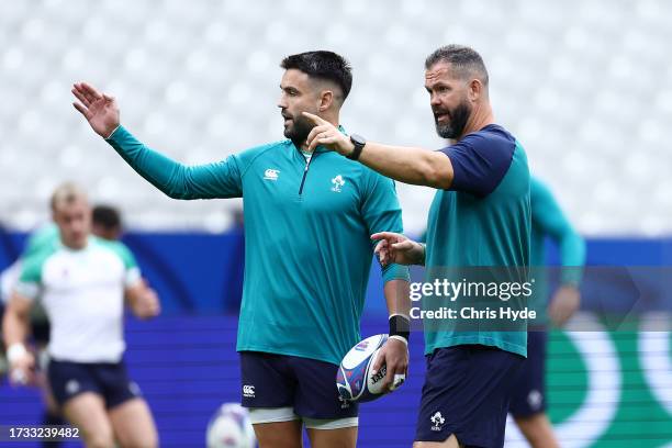 Conor Murray and Head coach Andy Farrell talk during the Ireland captain's run ahead of their Rugby World Cup France 2023 match against New Zealand...