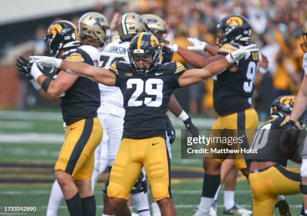 Defensive back Sebastian Castro of the Iowa Hawkeyes signals or a missed field goal during the first half against the Purdue Boilermakers at Kinnick...