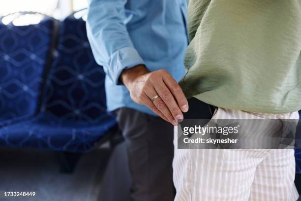 pickpocket in public bus! - mugger stock pictures, royalty-free photos & images