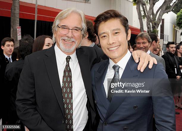 Director Dean Parisot and actor Byung-hun Lee attend the premiere of Summit Entertainment's "RED 2" at Westwood Village on July 11, 2013 in Los...