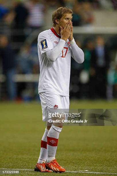 Marcel De Jong of Canada reacts after missing a goal against Mexico at CenturyLink Field on July 11, 2013 in Seattle, Washington. Mexico defeated...