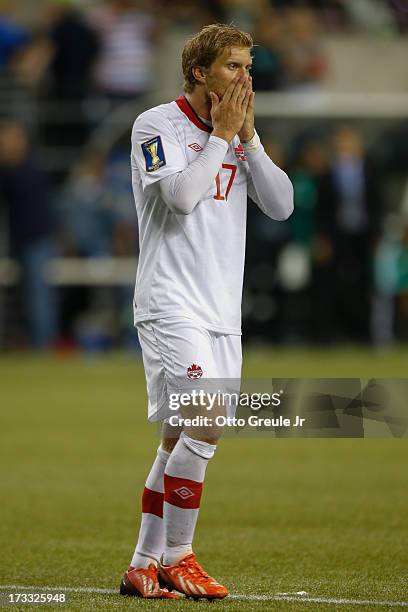 Marcel De Jong of Canada reacts after missing a goal against Mexico at CenturyLink Field on July 11, 2013 in Seattle, Washington. Mexico defeated...