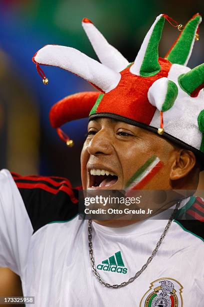 Fan of Mexico cheers during the match against Canada at CenturyLink Field on July 11, 2013 in Seattle, Washington. Mexico defeated Canada 2-0.