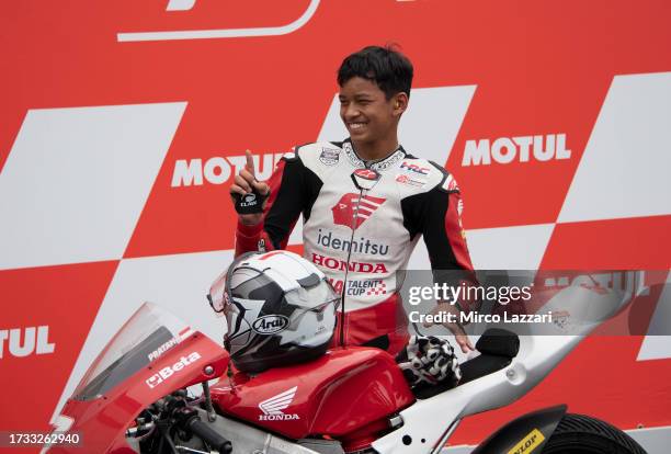 Veda Pratama of Indonesia celebrates the victory under the podium during the Idemitsu Asian Talent Cup race 2 during the MotoGP of Japan - Race at...