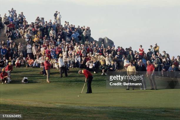 American golfer Arnold Palmer putts on the 13th green during the 36th Annual Crosby Pro-Am Golf Championship at Pebble Beach, California, January...
