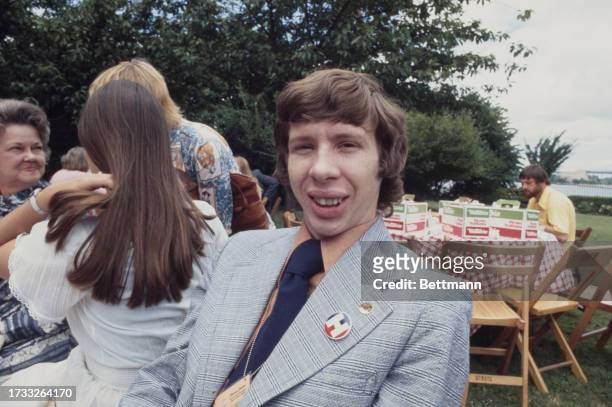 Jeff Carter, son of US presidential candidate Jimmy Carter, attending a picnic on the lawn of Gracie Mansion in New York, July 14th 1976. His wife...