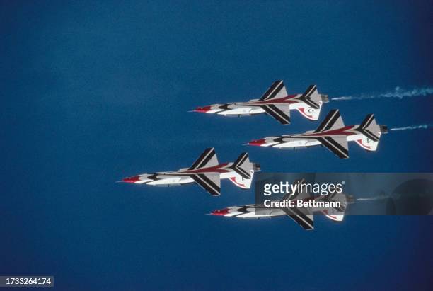 The US Air Force Air Demonstration Squadron 'The Thunderbirds' flying in formation at an unspecified location, circa 1977.