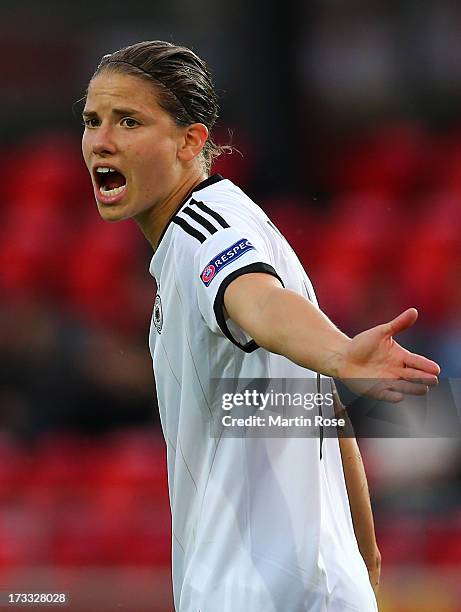 Of Germany battles for the ball with of Netherlands during the UEFA Women's Euro 2013 group B match at Vaxjo Arena on July 11, 2013 in Vaxjo, Sweden.