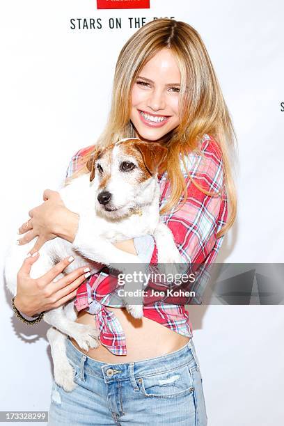 Actress Halston Sage and Uggie attend Abercrombie & Fitch Co. Presents their 2013 "Stars On The Rise!" at The Grove on July 11, 2013 in Los Angeles,...