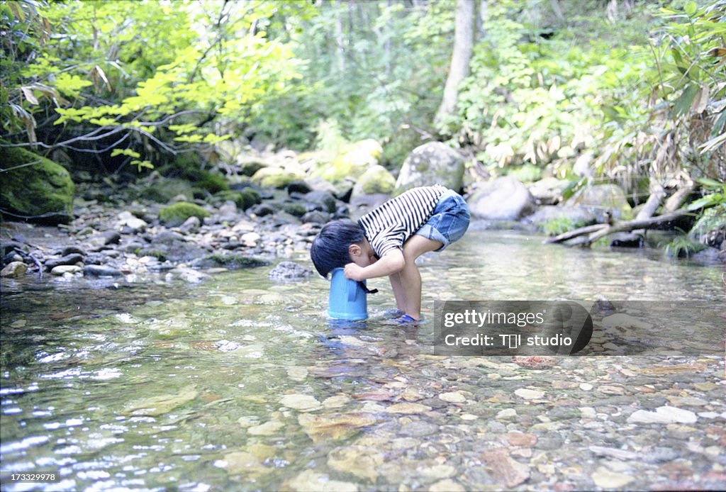 Small Boy Looking A In A Steam