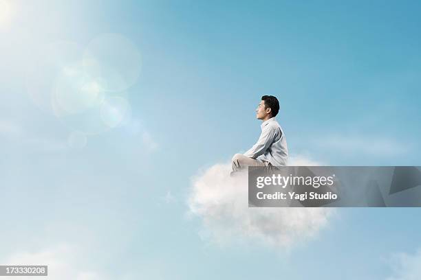 the man is relaxing above the clouds - sitting on a cloud stock pictures, royalty-free photos & images