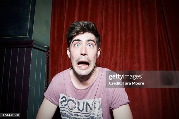 man making funny face - pull a face stock pictures, royalty-free photos & images