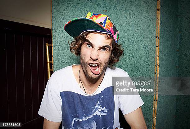 man making funny face - pull a face stock pictures, royalty-free photos & images