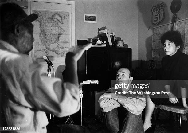 Folk singer Pete Seeger and his Toshi , sit during a recording session with Mississippi John Hurt