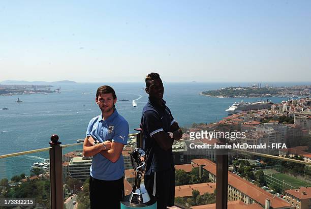 The captain of Uruguay Gaston Silva and the captain of France Paul Pogba pose for a photograph at the Ritz Carlton on July 12, 2013 in Istanbul,...