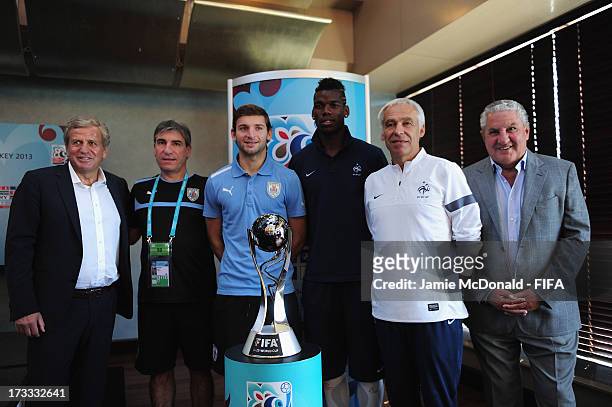 Servet Yardimci, President of the Local Organising Committee and Jim Boyce, Chairman of the FIFA Organising Committee pose with the captain and coach...