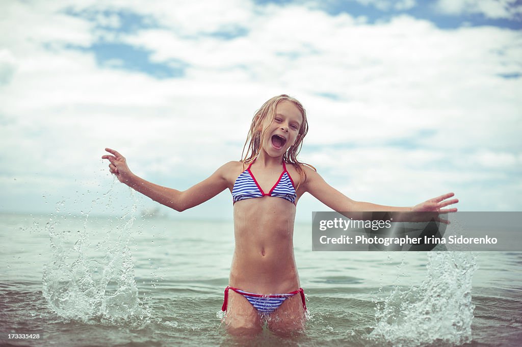 Girl frisking in the sea