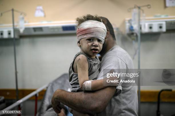 An injured child is brought to the Nassr hospital after the Israeli airstrikes in Khan Yunis, Gaza on October 19, 2023.