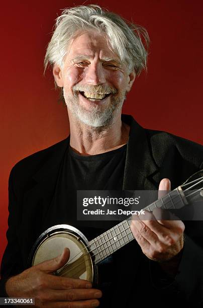mature man playing banjo - banjo stock pictures, royalty-free photos & images
