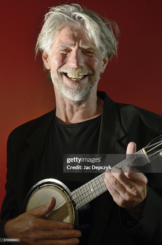 Mature man playing banjo