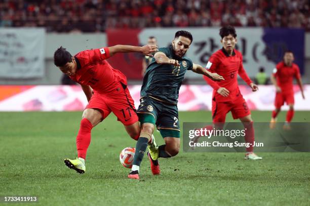 Hwang Hee-chan of South Korea competes for the ball with Wajdi Kechrida of Tunisia during the international friendly match between South Korea and...