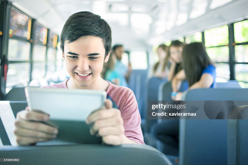 Playing With The Digital Tablet In A School Bus High-Res Stock Photo ...