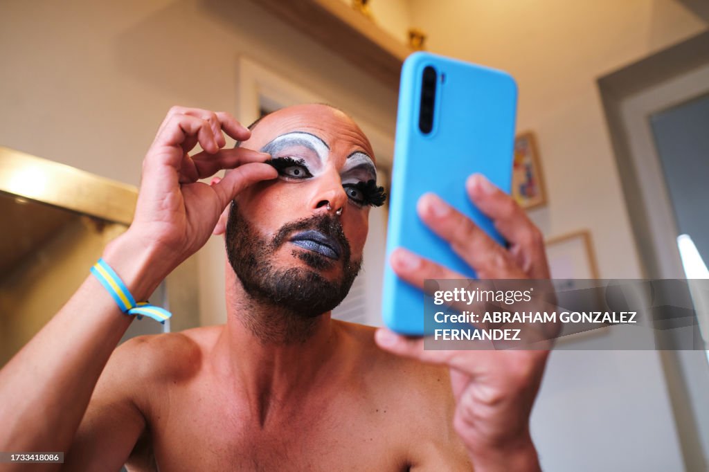 Close-up of a drag queen applying false eyelashes