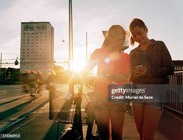 teenage girls by sunset - copenhagen cycling stock pictures, royalty-free photos & images