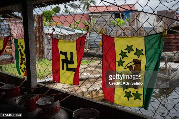 Revolutionary flags typical of the communities of the Kuna Yala region hang in a fence on October 11, 2023 in Gardi Sugdub, Panama. Indigenous...