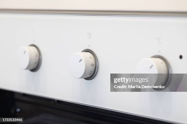 control knobs of built-in modern oven - microwave timer stock pictures, royalty-free photos & images