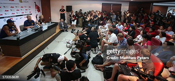 Manager David Moyes and Rio Ferdinand of Manchester United attend a press conference at Rajmalanga Stadium as part of their pre-season tour of...