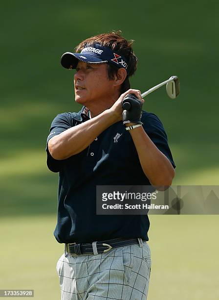 Joe Ozaki of Japan hits a shot on the tenth hole during the second round of the 2013 U.S. Senior Open Championship at Omaha Country Club on July 12,...