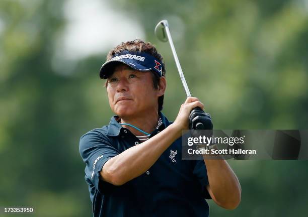 Joe Ozaki of Japan hits his tee shot on the tenth hole during the second round of the 2013 U.S. Senior Open Championship at Omaha Country Club on...