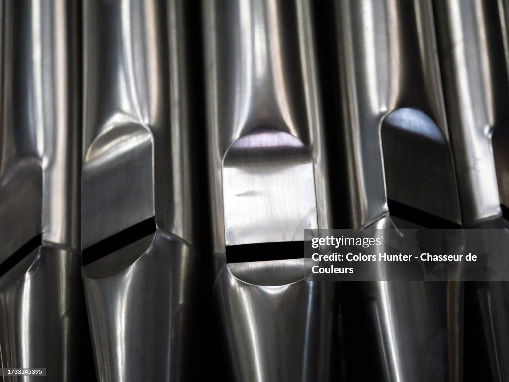 Close-up of the metal wind tubes of a church organ in Brussels, Belgium