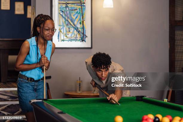 lining up the next shot - pool table fun stock pictures, royalty-free photos & images