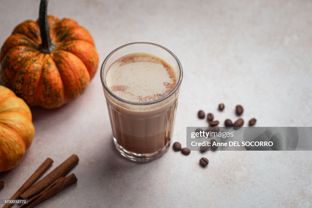 Homemade pumpkin spice latte coffee with cinnamon and milk