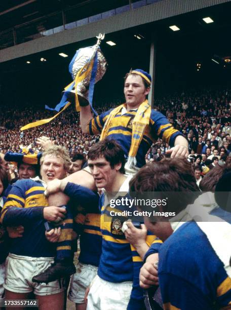 Leeds rugby league team captain David Ward celebrates with the Challenge Cup trophy after their victory over St Helens in the Rugby League Challenge...